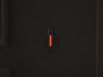 Vega Light-Pull in red glowing at night